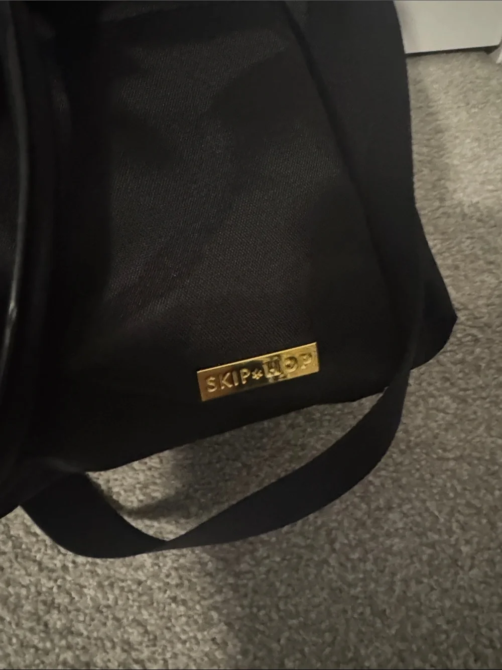 Black Skip Hop Bag with Gold Hardware